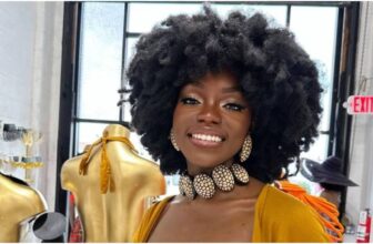 photo of a lady on choker necklace and a big afro hair