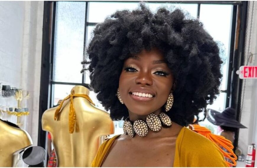 photo of a lady on choker necklace and a big afro hair