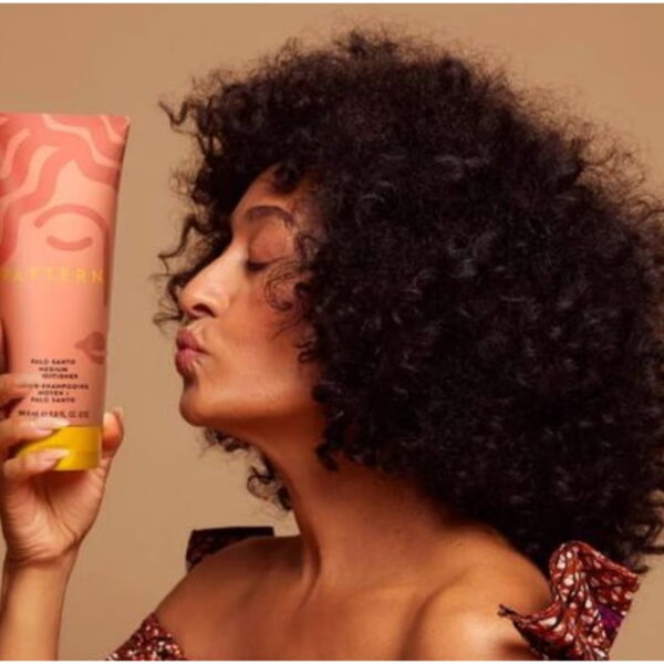 photo of tracee ellis ross holding her pattern beauty curl cream