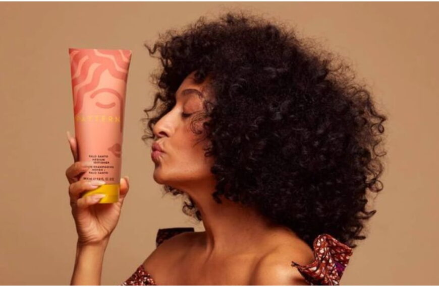 photo of tracee ellis ross holding her pattern beauty curl cream