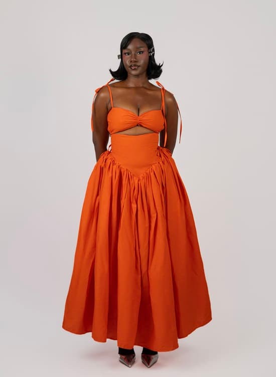 Summer Vacation on Your Mind? 10 Dresses to Shop Now Shop Boma Cutout Ankle Length Dress (Orange) - Fashion Police Nigeria