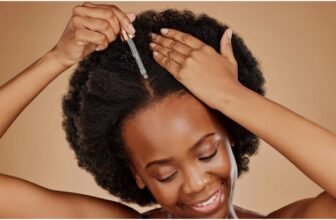 photo of a lady applying hair oil