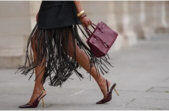 photo of a lady carrying a designer bag