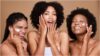 photo of 3 ladies applying moisturizer on their face