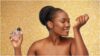 photo of a lady spraying perfume