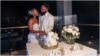 bride and groom cutting their cake