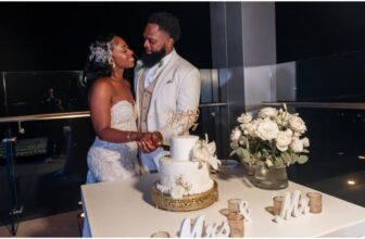 bride and groom cutting their cake