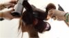 photo of a lady making her hair