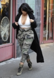 Kim Kardashian puts her huge cleavage on display in plunging crop top