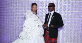 Rihanna Showcases Her Baby Bump In Tiny Leather Mini Skirt And Trench Coat
