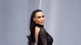 Kim Kardashian is a Dream in a Clingy High-Neck Lace Dress at Paris Fashion Week