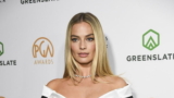 Margot Robbie’s Little Black Balmain Dress Pays a Tribute to the Vintage Barbie
