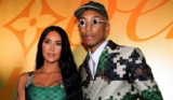 Kim Kardashian Wears “Damoflage Print” Athleisure to Support Pharrell Williams’ Louis Vuitton Paris Fashion Week Show
