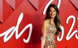 Amal Clooney is a Refined Elegance in a Sequin Gold Gown at the Fashion Awards