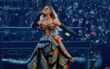 Beyonce Dazzles in a Vibrant Versace Dress at the Tottenham Cowboy Carter Show