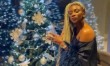 Genevieve Nnaji Poses Beside Her Christmas Tree To Show Off Her Blonde Braids