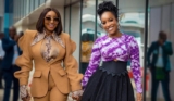 Ini Edo Puts a Modern Spin on the Brown Pantsuit as She Poses With Joselyn Dumas in Ghana