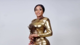 Ini Edo Squeezes Her Enviable Figure Into A Gold Metallic Bodycon Dress