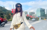 Ini Edo Killed it in a Long Jacket, Leather Leggings, and Valentino Sock Boots
