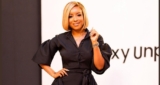 Joselyn Dumas Showcases Her Style Prowess In A Black Flowing Gown By Zuri Azalea