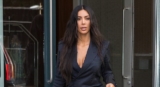 Kim Kardashian Just Wore The Pinstripe Pantsuit In The Most Sexy Way