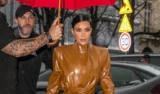 Kim & Kourtney Kardashian’s Fresh New Balmain Latex Suit Turned Heads In Paris