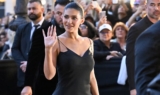 Kylie Jenner Just Made Her Paris Fashion Week Arrival in a Plunging Black Dress