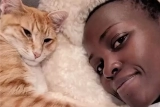 Lupita Nyong’o and Her Cat Yoyo Dressed Up in Red for Christmas