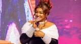 Omotola Jalade is Pretty in a Black Dress and White Accessories at an IWD Event in Ghana
