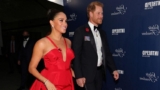 Meghan Markle Wore a Breathtaking Red Gown With Prince Harry on the Red Carpet