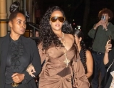 Rihanna Shows Off Her Fashionable Side in a Brown Silk Dress at New York Fashion Week
