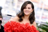 Selena Gomez is Pretty in a Red Off-The-Shoulder Dress with Roses in Cannes