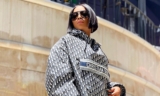 Toke Makinwa Drapes Herself In A Christian Dior Hooded Shirt Dress, Handbag & Sneakers